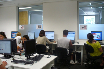 Classroom students using computers working