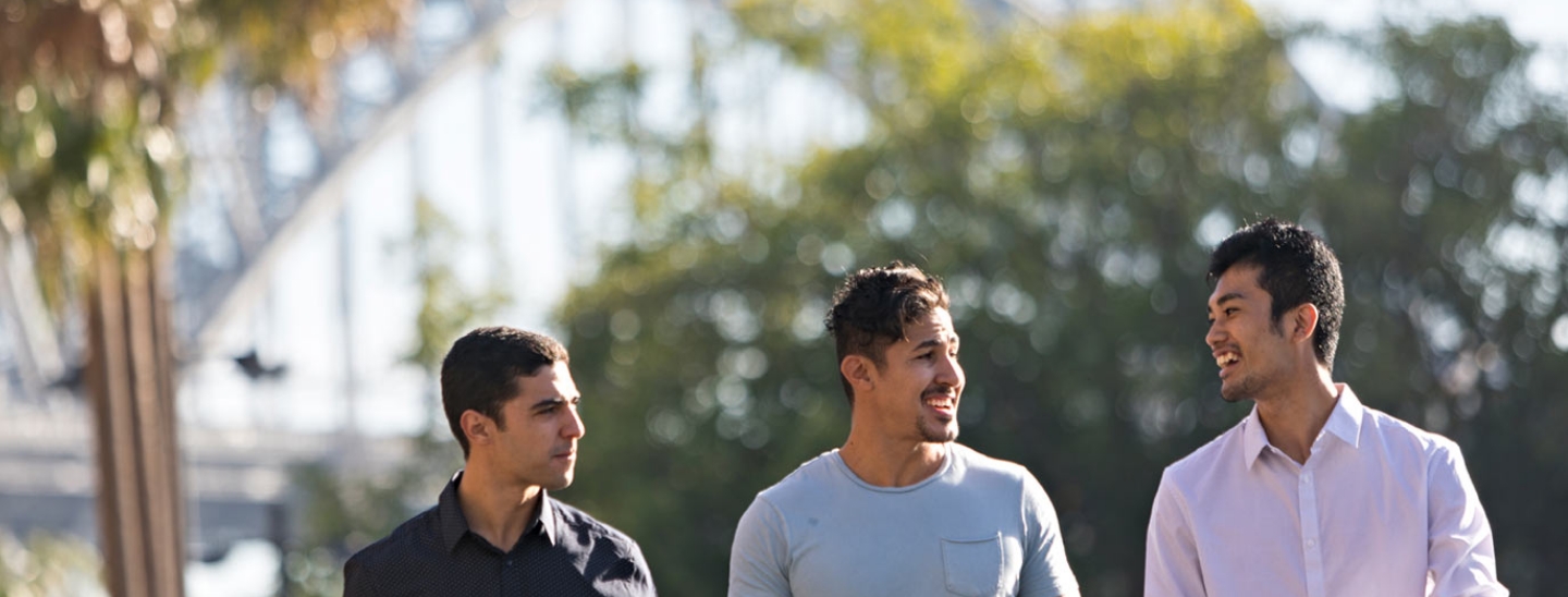 Male students walking outside sydney