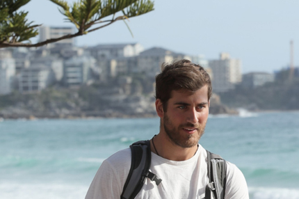 Student outside sydney beach