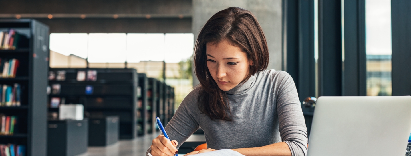 Student studying inside concentrating