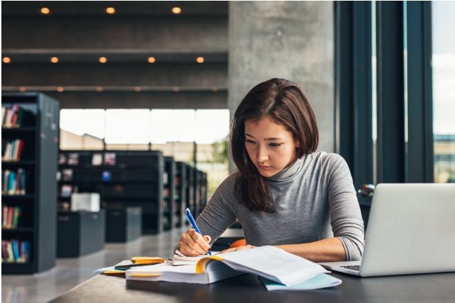 Student studying inside concentrating