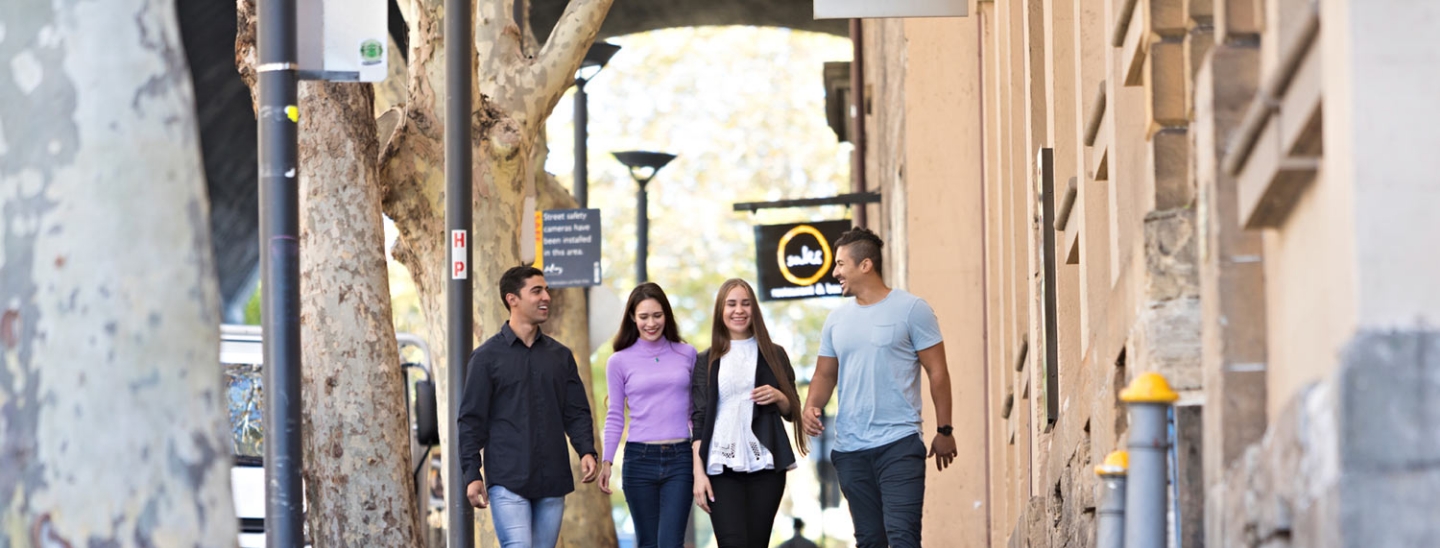 Student walkng outside sydney