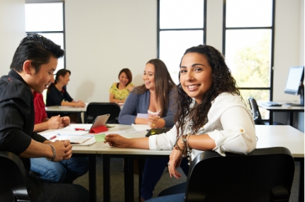 Students in classroom happy working