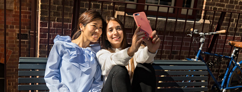 Students on campus happy taking photo