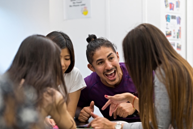 Students on campus happy together working