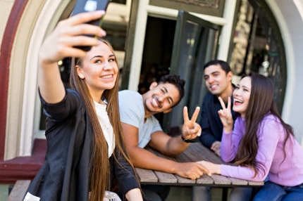 Students on campus taking selfies