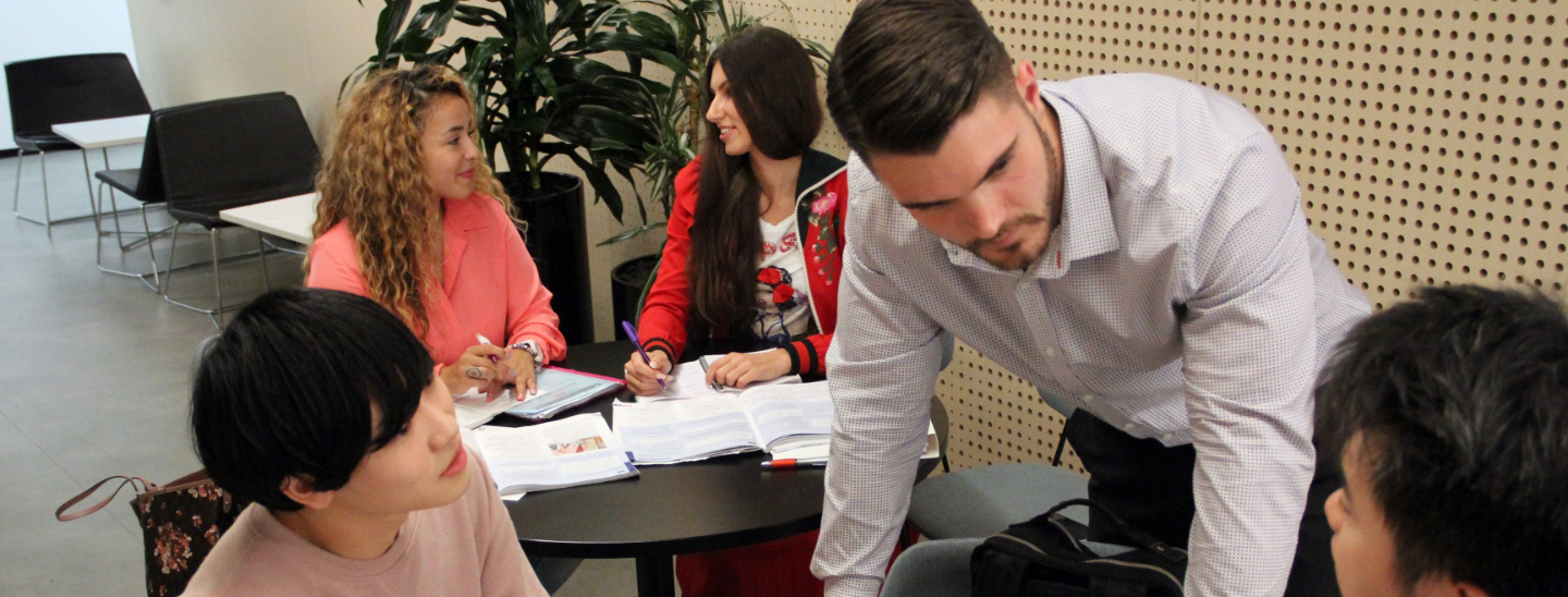 Students together inside working