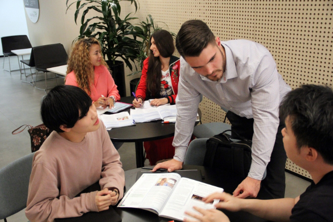 Students together inside working