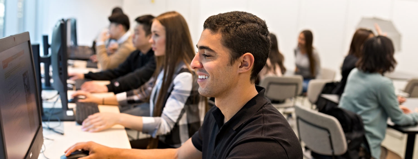 Students using computers happy working