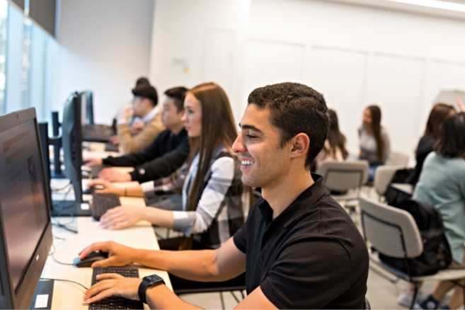 Students using computers happy working