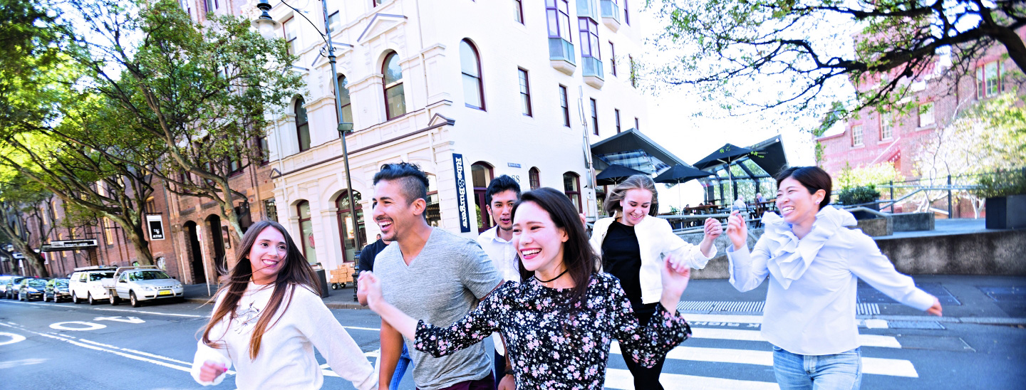 Students walking outside campus happy laughing